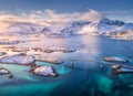 Aerial view of bridge over the sea and snowy mountains in Norway Royalty Free Stock Photo