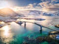 Aerial view of bridge over the sea and snowy mountains in Norway Royalty Free Stock Photo