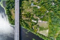 Aerial view of the bridge and the road over the Dnepr River over a green island in the middle of the river