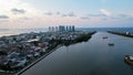 Aerial view of the Bright spring cityscape of Pluit port. Colorful sunset view of Jakarta, Indonesia. Beautiful Jakarta seascape.