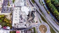 Aerial view, building, car park and highway passing through town Royalty Free Stock Photo