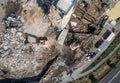 Aerial view of Building House Demolition and construction site Excavator with hydraulic crasher machine Royalty Free Stock Photo