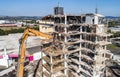 Aerial view of Building House Demolition and construction site Excavator with hydraulic crasher machine Royalty Free Stock Photo