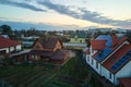 Aerial view building roof with rows of blue solar photovoltaic panels for producing clean ecological electric energy