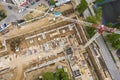 Aerial view of building under construction and tower crane. construction site in progress Royalty Free Stock Photo