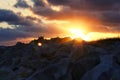 Aerial view of buildings behind rocks during sunset in Urville-Nacqueville