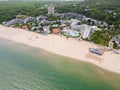 Aerial view of the Bulgarian town of Albena unfolds along the picturesque seaside. Its sandy beaches, stretching as far