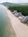 Aerial view of the Bulgarian town of Albena unfolds along the picturesque seaside. Its sandy beaches, stretching as far