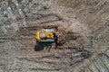 Aerial view of a bulldozer moving waste on a landfill site Royalty Free Stock Photo