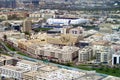 Aerial view of Bur Dubai the oldest district of Dubai, with low rise buildings and a beautiful stadium to host sport competition.