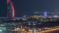 Aerial view of Burj Al Arab hotel from Internet city night timelapse. Royalty Free Stock Photo