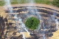 Aerial view of burning field with smoke