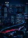 Aerial view of a bustling city illuminated by the bright lights of the tall skyscrapers. Japan Royalty Free Stock Photo