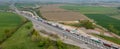 an aerial view of a busy highway full of vehicles driving down it's side Royalty Free Stock Photo