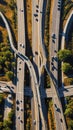 aerial view of a busy metropolitan highway intersection showing a complex network of roads lanes and ramps