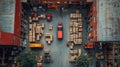 Aerial view of a busy warehouse with trucks and stacked boxes ready for distribution Royalty Free Stock Photo
