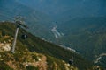 aerial view cable car to the Rosa Khutor resort in Sochi, Russia against of the Caucasus mountains Royalty Free Stock Photo