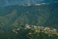 aerial view from cable car to the Rosa Khutor resort in Sochi, Russia against of the Caucasus mountains Royalty Free Stock Photo