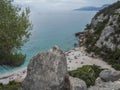 Aerial view of Cala Fuili beach near Cala Gonone, Gulf of Orosei, Sardinia island, Italy. White pebbles beach with Royalty Free Stock Photo