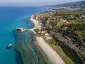 Aerial view of the Calabrian coast, villas and resorts on the cliff. Transparent sea and wild coast Royalty Free Stock Photo