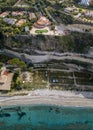 Aerial view of the Calabrian coast, villas and resorts on the cliff. Transparent sea and wild coast Royalty Free Stock Photo