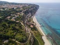 Aerial view of the Calabrian coast, villas and resorts on the cliff. Transparent sea and wild coast Royalty Free Stock Photo