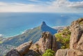 Aerial view of a calm ocean and a mountain with blue cloudy sky background and copy space. Beautiful nature landscape of Royalty Free Stock Photo