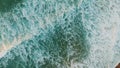 Aerial view calm waves splashing on sand shoreline making white foam. Sea swell Royalty Free Stock Photo