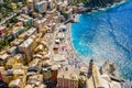 Aerial view of Camogli. Colorful buildings near the ligurian sea. View from above on the public beach with azure and clean water