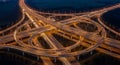 Aerial View of a Complex Highway Interchange at Night with Light Trails from Cars traffic Royalty Free Stock Photo