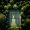 aerial view captures a tennis field nestled within a serene wooded area.