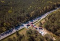 Aerial view of a car accident, police and firefighters in a summer forest