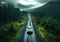aerial view of the car driving of country road through green woods Royalty Free Stock Photo
