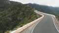 Aerial view. The car goes on the road paved high along the mountain serpentine. Tenerife, Spain Royalty Free Stock Photo