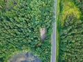 Aerial view on car parking in forest with round lake