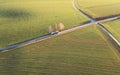 an aerial view of a car driving down a country road Royalty Free Stock Photo