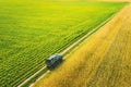 Aerial View Of Car SUV Parked Near Countryside Road In Spring Field Rural Landscape. Car Between Young Wheat And Corn Royalty Free Stock Photo