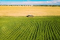 Aerial View Of Car SUV Parked Near Countryside Road In Spring Field Rural Landscape. Car Between Young Wheat And Corn Royalty Free Stock Photo