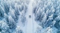 Aerial view of car and truck on winter forest road, driving through snowy landscape Royalty Free Stock Photo