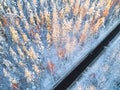 Aerial view of a car on winter road in the forest. Winter landscape countryside. Aerial photography of snowy forest with a car on Royalty Free Stock Photo