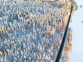 Aerial view of a car on winter road in the forest. Winter landscape countryside. Aerial photography of snowy forest with a car on Royalty Free Stock Photo