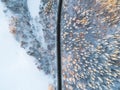 Aerial view of a car on winter road in the forest. Winter landscape countryside. Aerial photography of snowy forest with a car on Royalty Free Stock Photo