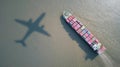 Aerial view of cargo ship with airplane shadow on ocean surface Royalty Free Stock Photo