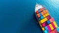 Aerial View of a Cargo Ship Loaded with Colorful Containers on Deep Blue Royalty Free Stock Photo