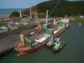 aerial view of cargo ship in port loading supplies for humanitarian aid