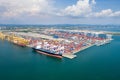 Aerial view of cargo ships loading containers at seaport Royalty Free Stock Photo