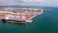 Aerial view of cargo ships loading containers at seaport Royalty Free Stock Photo