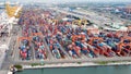 Aerial view of cargo ships loading containers at seaport Royalty Free Stock Photo