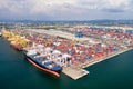 Aerial view of cargo ships loading containers at seaport. Royalty Free Stock Photo