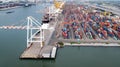 Aerial view of cargo ships loading containers at seaport Royalty Free Stock Photo